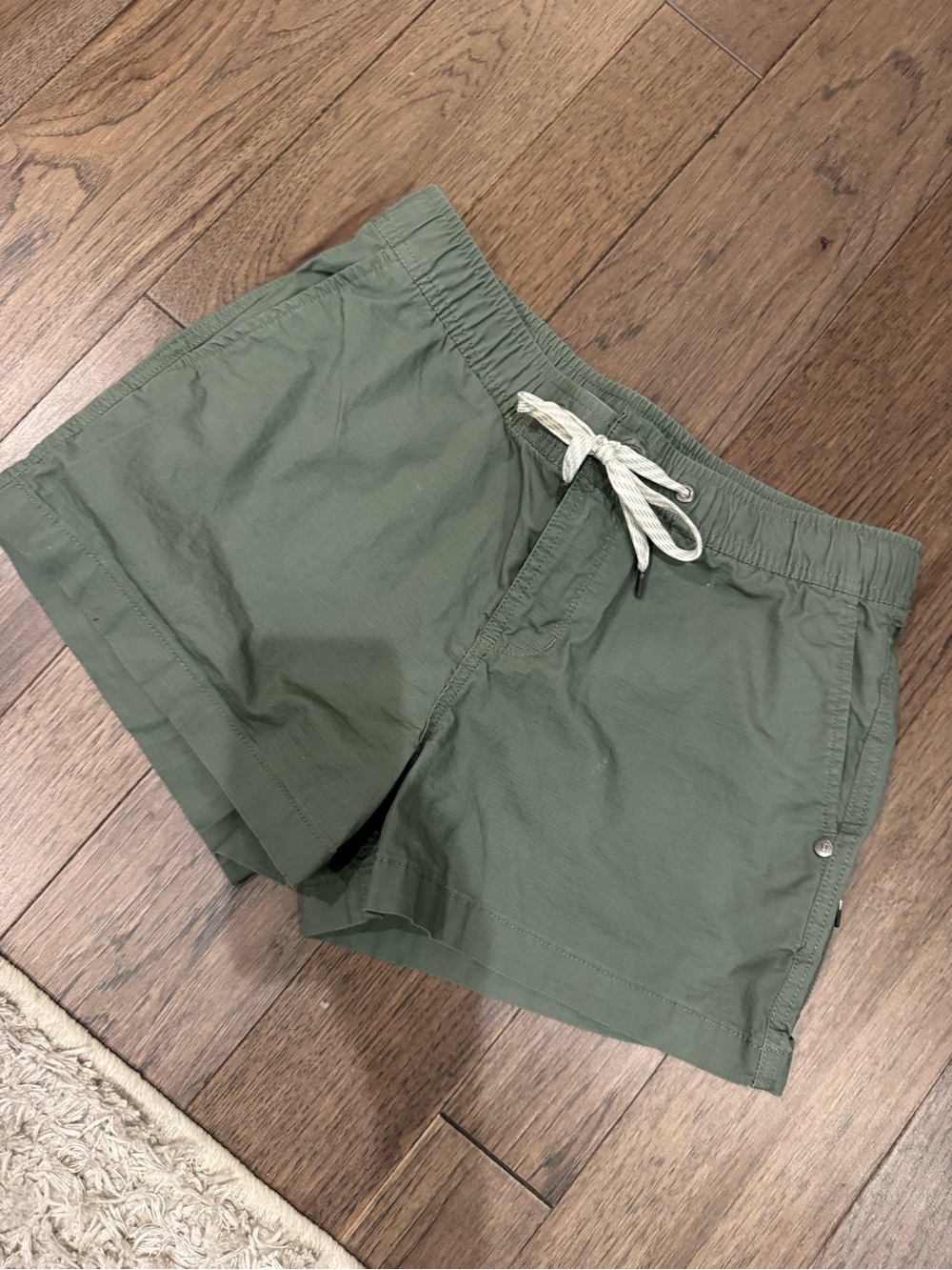 Vuori Women's Ripstop Shorts in a olive green color
